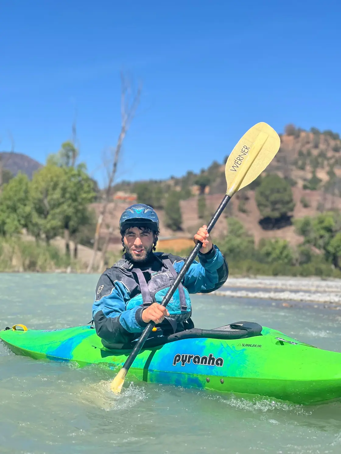 Paddler holding a kayak paddle